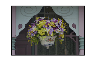 hanging potted flowers on a Victorian porch