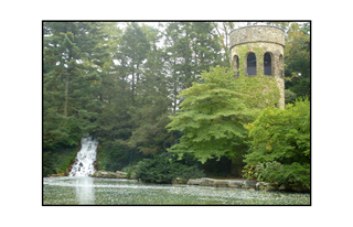 Longwood Castle in Fog by a Waterfall