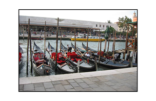 Gondolas docked in the Venetian waterway