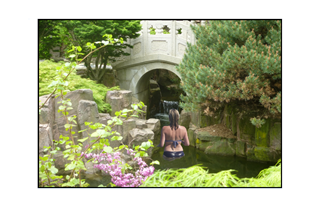 woman in garden pool of water