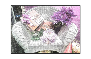 Wicker Chair with candy, chocolate and flowers