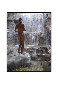 woman in thong swimsuit stepping into waterfall