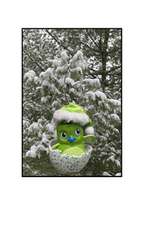 Christmas hatchling in snow covered tree