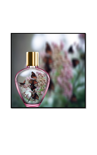 butterflies in pink glass perfume bottle