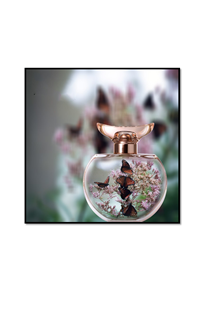 butterflies in a glass perfume bottle