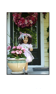 Cape May Doll standing by flower pot