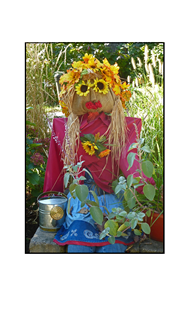 Hershey Scarecrow with flowered eyes and water can