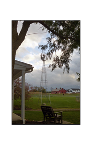 Lancaster porch with bench, windmill and barn