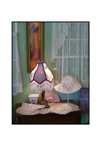 Victorian table with lamp, fan and hat