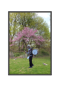 one man music band playing in park